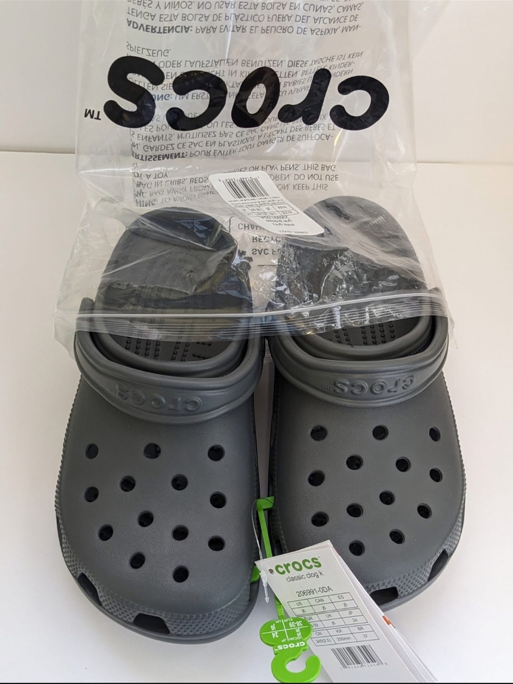 Crocs. Kids size 6 
Gray. 
New. Junior